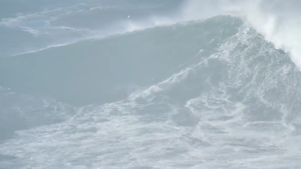 Guy Displays Skills by Surfing Over Gigantic Wave in Sea