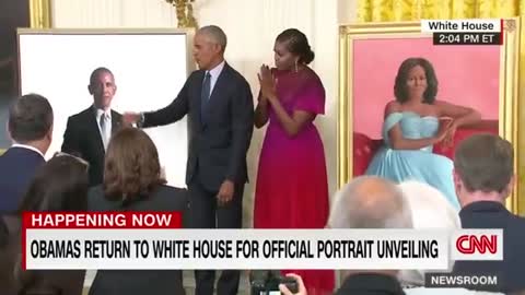 Barack Obama gives a speech after the unveiling of his White House portrait