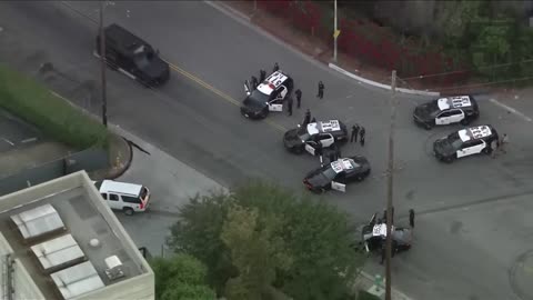 Violent pursuit suspect apprehended following extended standoff in Los Angeles.