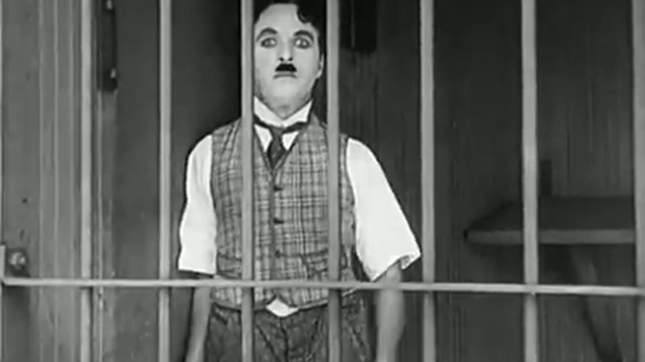 Charle Chaplin in lion cage