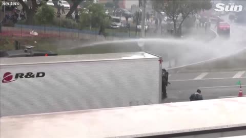 Brazilian police fire water cannons and rubber bullets at anti Lula protesters