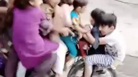 You can count how many children are sitting on top of the bike