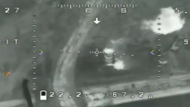 Ukrainian drone dropping grenades on a Russian vehicle.