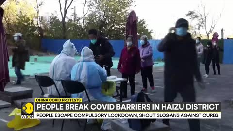 China COVID protests_ People break COVID barriers in Haizhu district _ World English News _ WION (1)