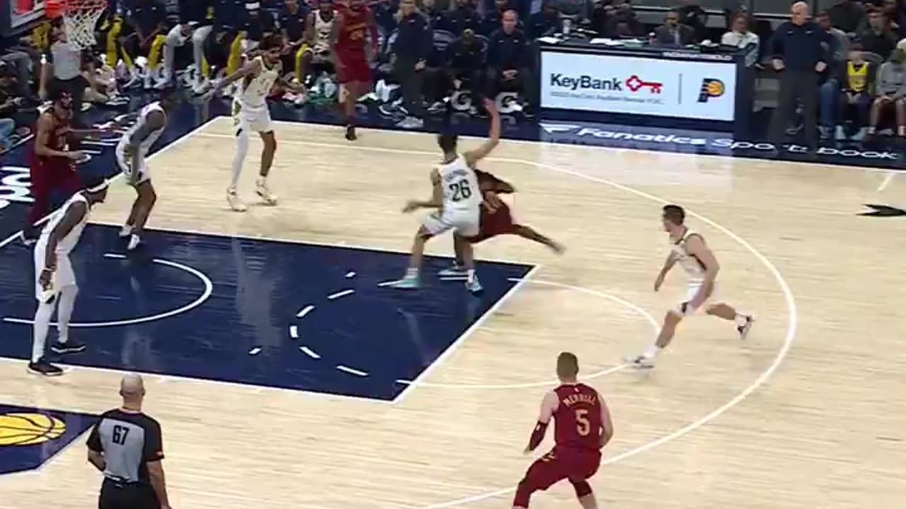 NBA - Darius Garland draws the defense and dumps off the flashy assist to Jarrett Allen!
