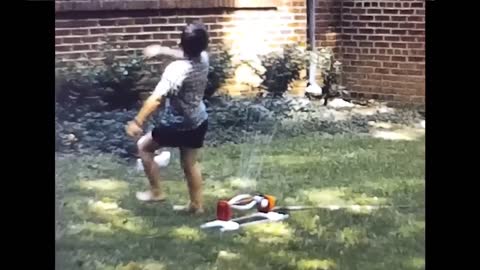 John and David Play in the Sprinkler on Franklin St