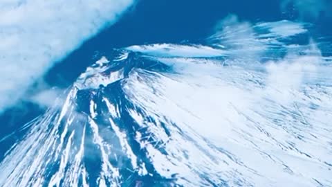 Blue mountain and moving clouds