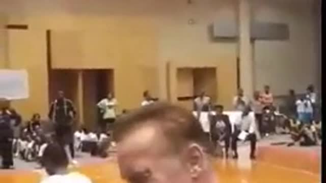 Man Drop kicks Arnold Schwarzenegger at sporting Event.