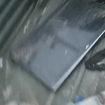 Searching What Remains of Russian Transport with Looted TVs in the Back