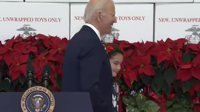 Biden directed offstage by child after remarks