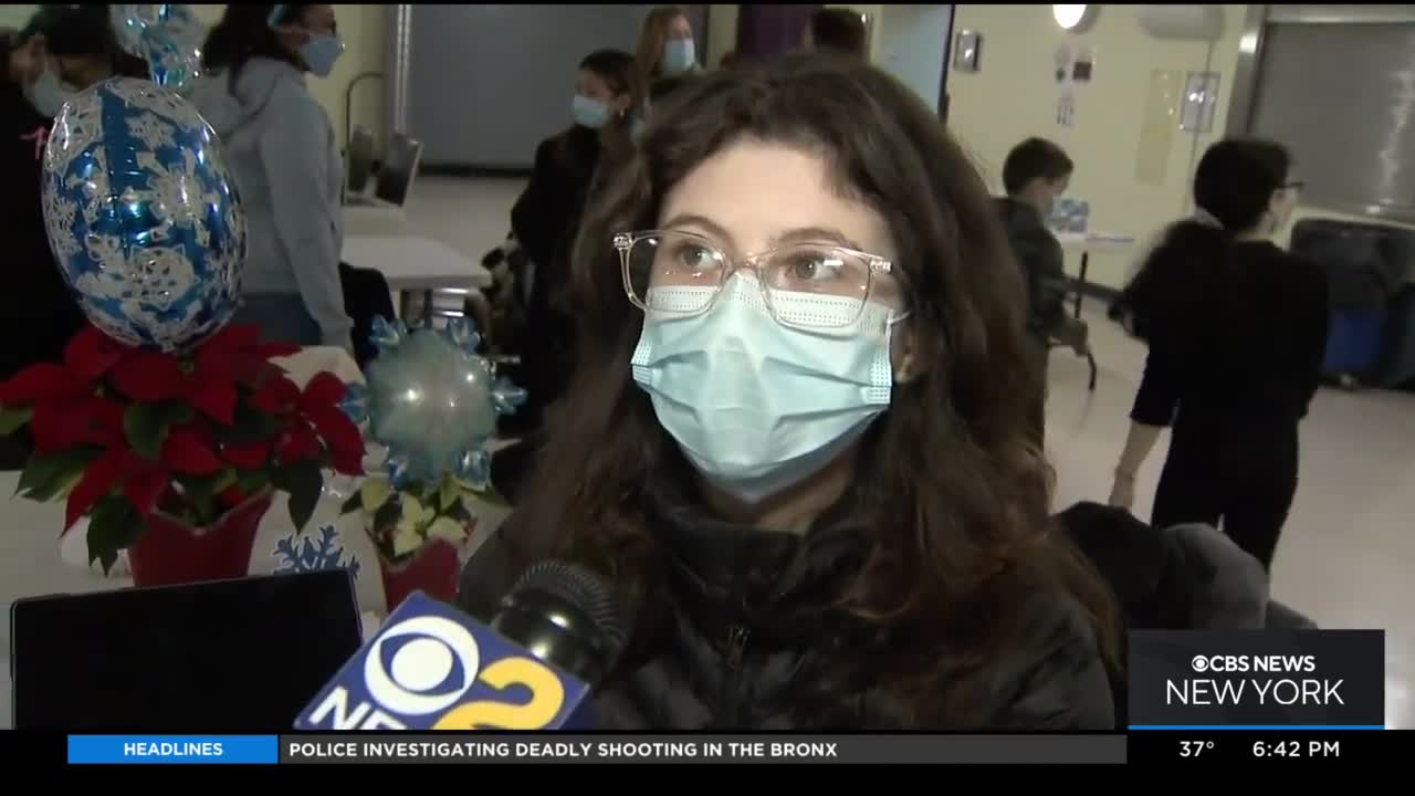 Teen cancer survivor helps pack gift bags for cancer patients