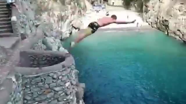 He is not afraid of jumping into the water at such a high altitude.