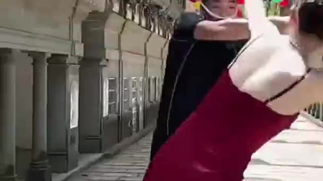 Chinese Woman in Red Dress Dodging Bat (Full Video)