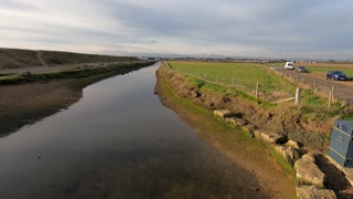 Walking over a bridge . Pretend drone shot.