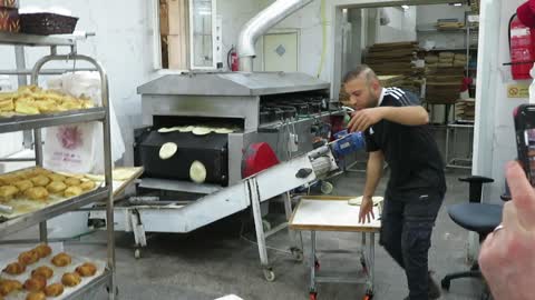 Fresh pita bread out of the ovens in Jaffa, Israel. Come walk with me, Steve Martin