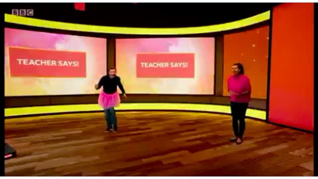 Man on tutu teaching algebra on the BBC