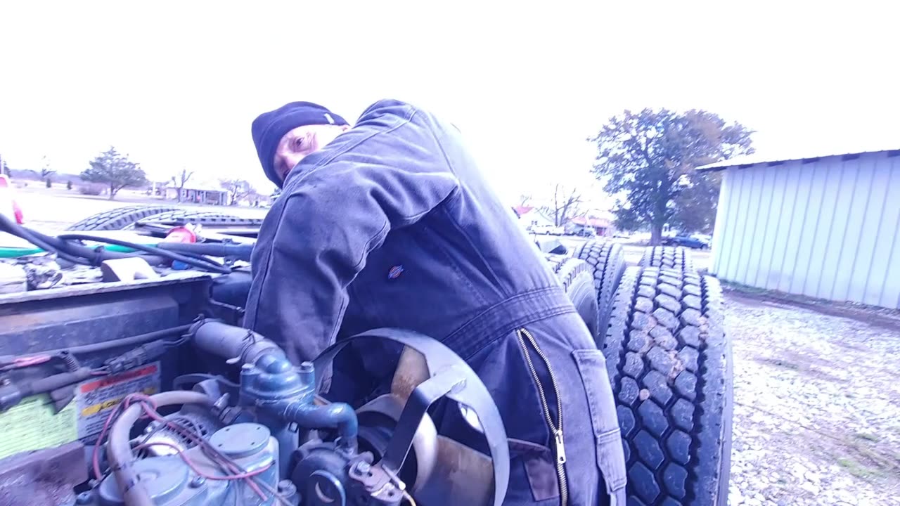 JUVENILE SON FILMS HIS FATHER WORKING ON FREIGHTLINER AUXILIARY POWER UNIT