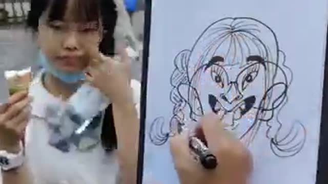 Drawing caricatures of random people in the street