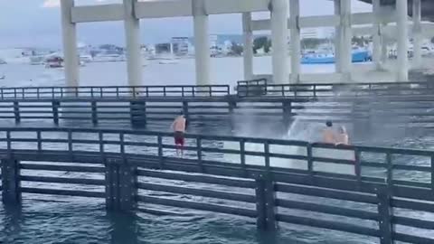 Guy Flops Hard Diving Off 80 ft Bridge