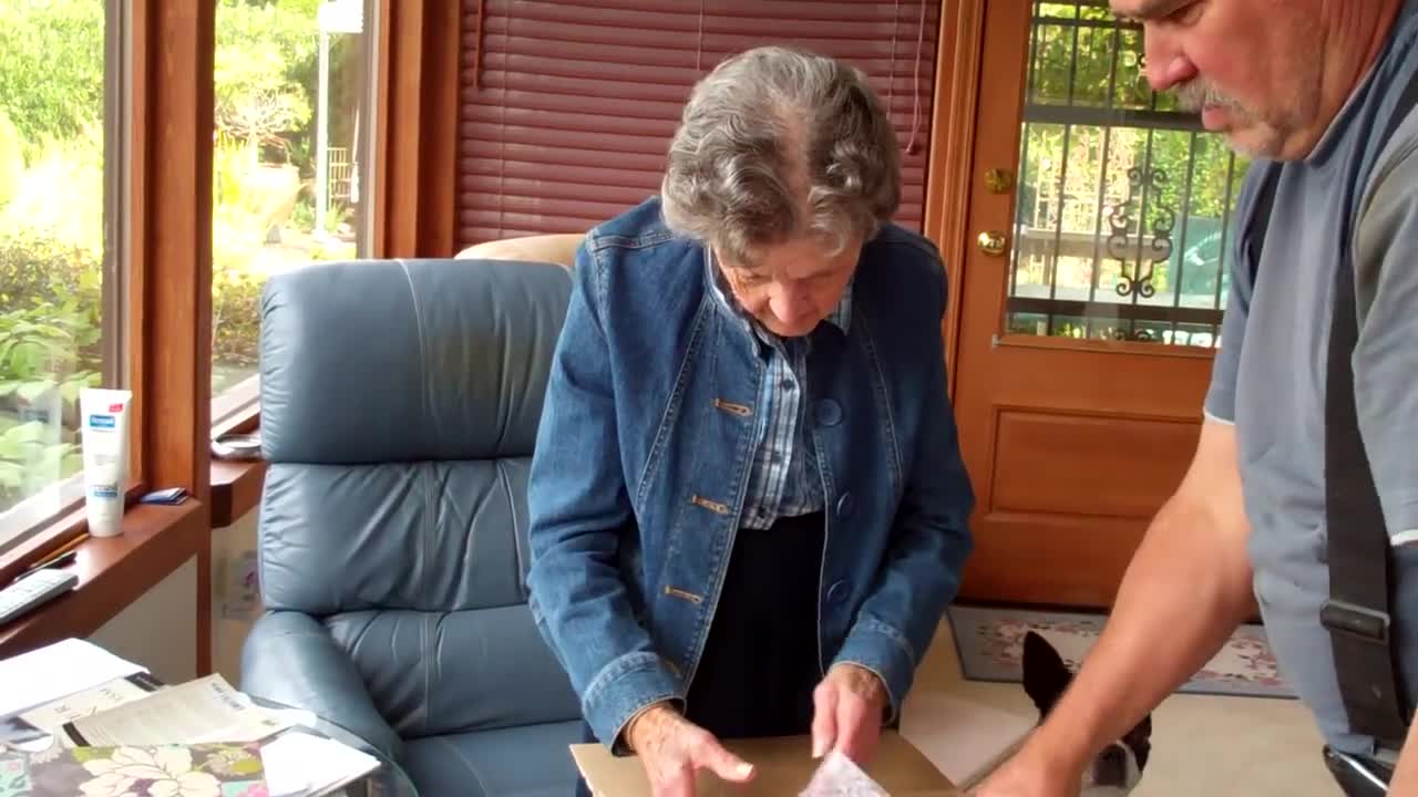 My dear mother receiving a palm table that reminds her of her father