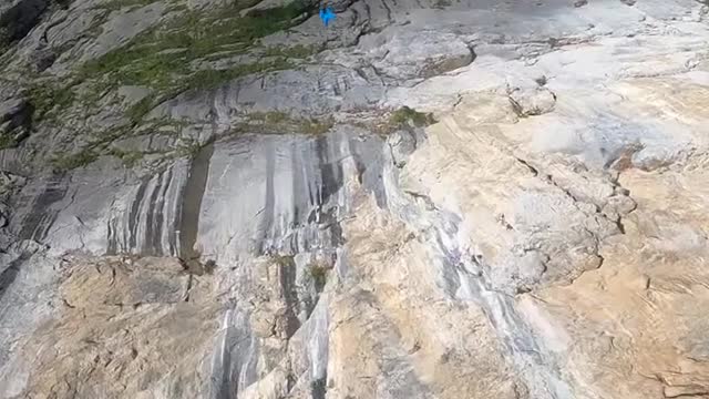 Base jumping triple front flip.