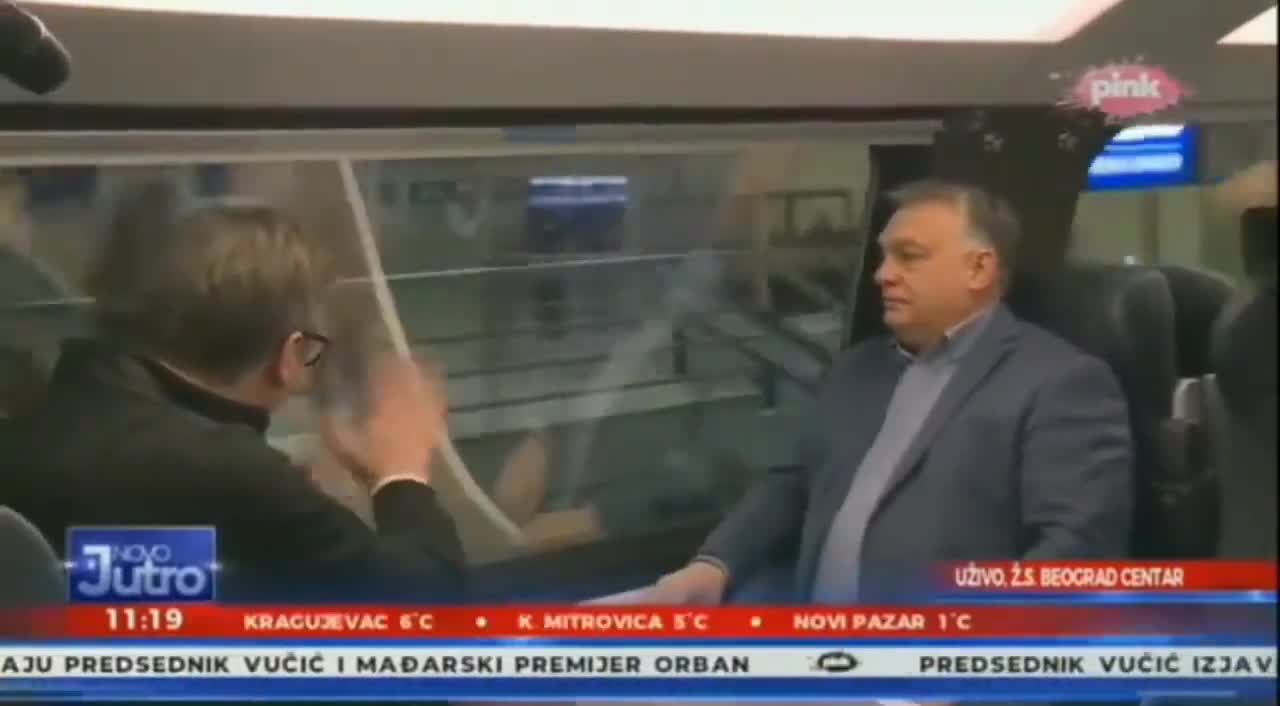 In the video, the Serbian president waves his hand through the train window.