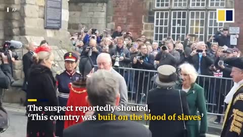 King Charles narrowly avoids being hit by eggs thrown at him during public meeting