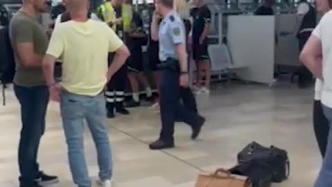 Harry Kane poses for selfies with fans at the airport after marking his Bundesliga debut