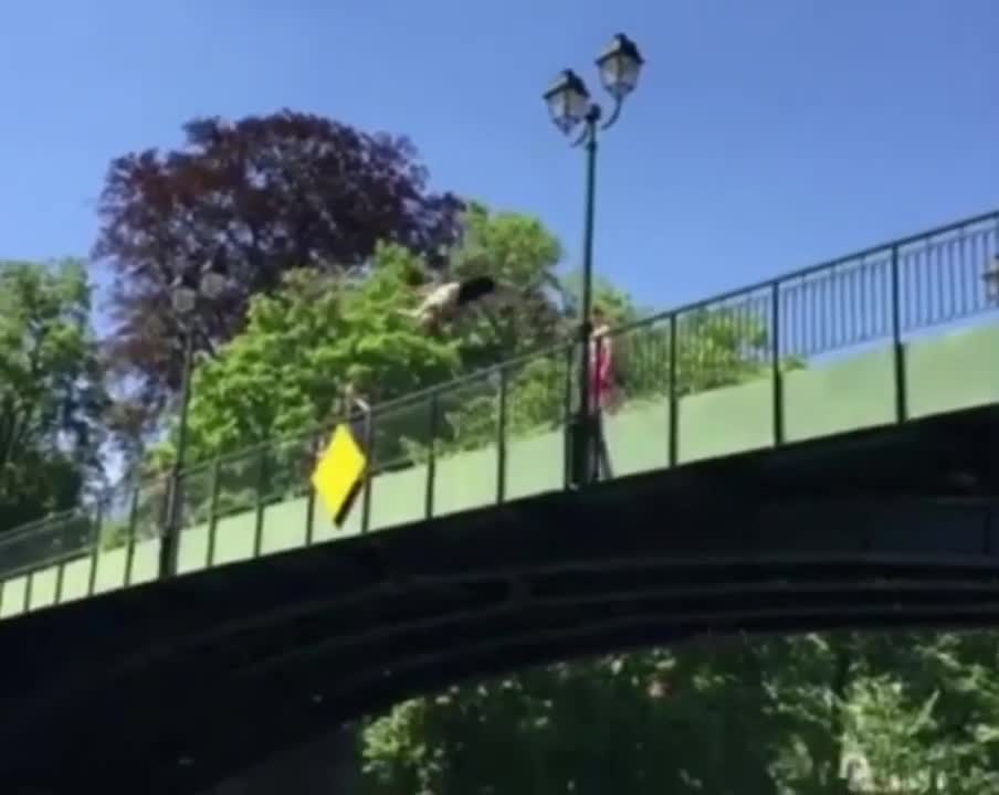 Guy Flops Into A River Doing A Backflip Off A Bridge