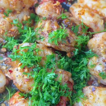 "Savor the Flavors: Indulge in the Irresistible Delight of Butter Garlic Tiger Prawns 🍤"