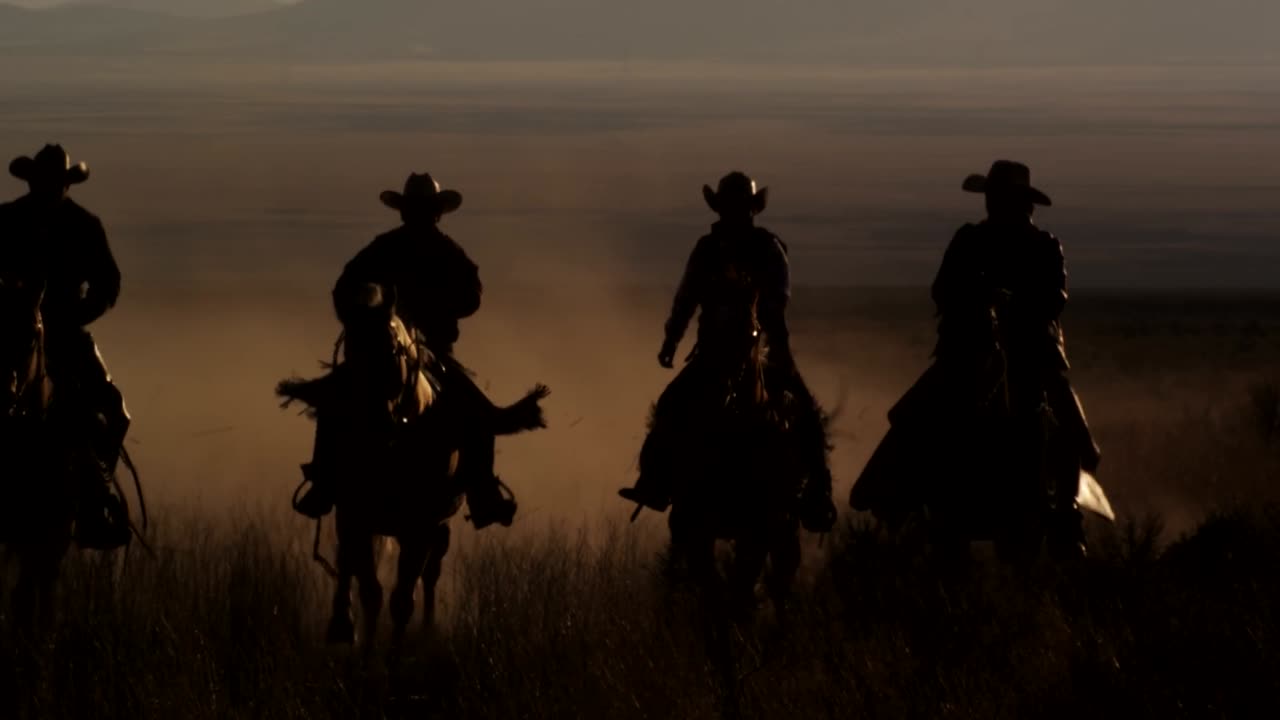 Cowboys Riding Horses At Sunset in Old West Desert Slow Motion [Free Stock Video Footage Clips]