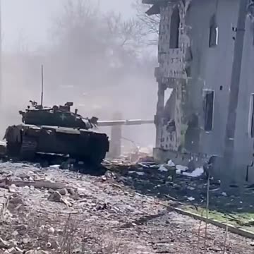 Tank of the 93rd Mechanized Brigade working from cover in Bakhmut