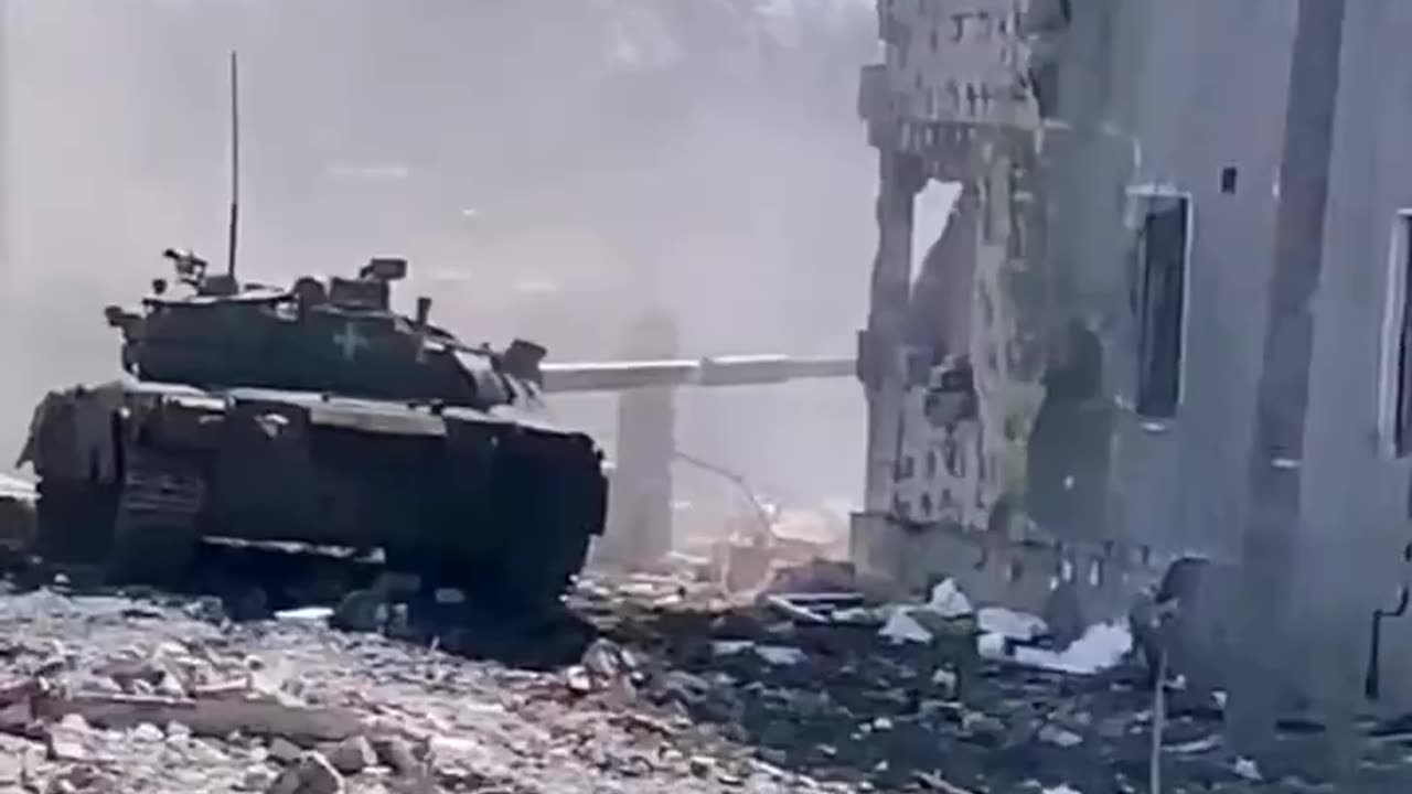 Tank of the 93rd Mechanized Brigade working from cover in Bakhmut