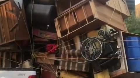 Loaded Mini Truck Helps in Moving Huge Pile of House Stuff