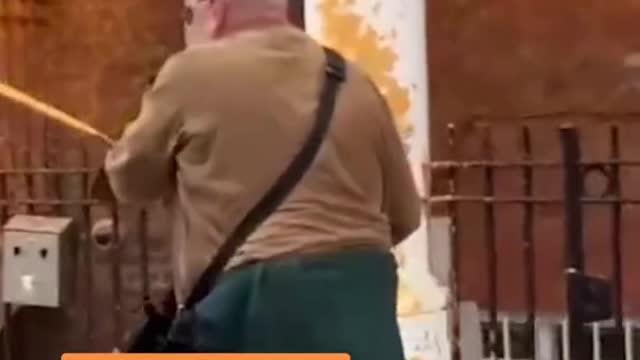 In London, green protesters blocked a road and sprayed orange paint on a building