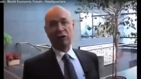 Evil Klaus Schwab caught on button camera