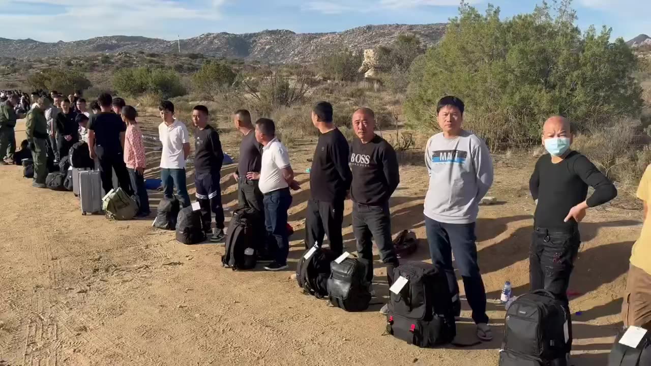 A large amount of Chinese men illegally traveling to unsecure sections of the border wall in CA