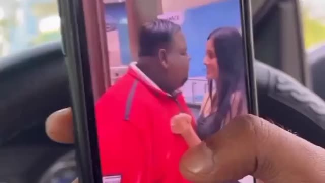 Black man kiss cute Girl in front of Peoples