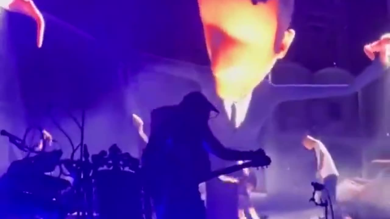 Macron depicted as a puppeteer leading the French into the abyss at the solidays festival in Paris.