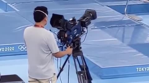 Enjoyed this cameraman following the action at the trampoline gymnastics