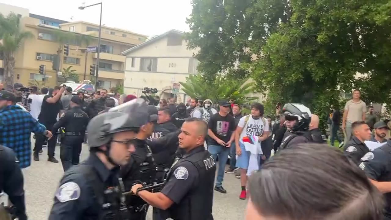 Brawl outside a school district meeting in Glendale CA to determine pro-noun requirements