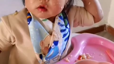 Funny baby eating meal