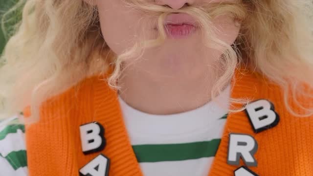 A Woman Smelling Her Hair