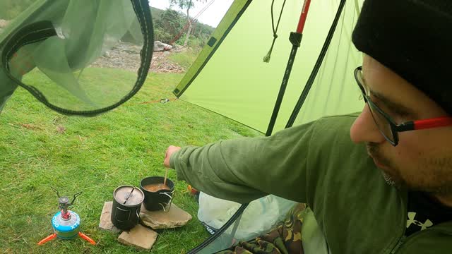 Making a coffee in the tent . Riverside wildcamping GoPro