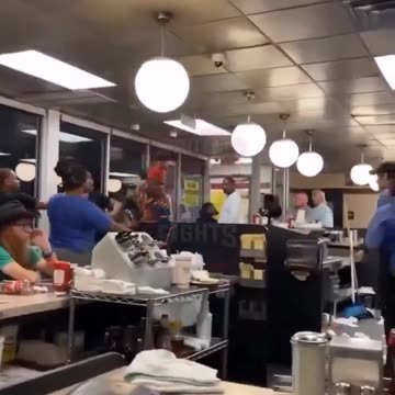 out of control dyed haired individual attacks white Waffle House staffers.
