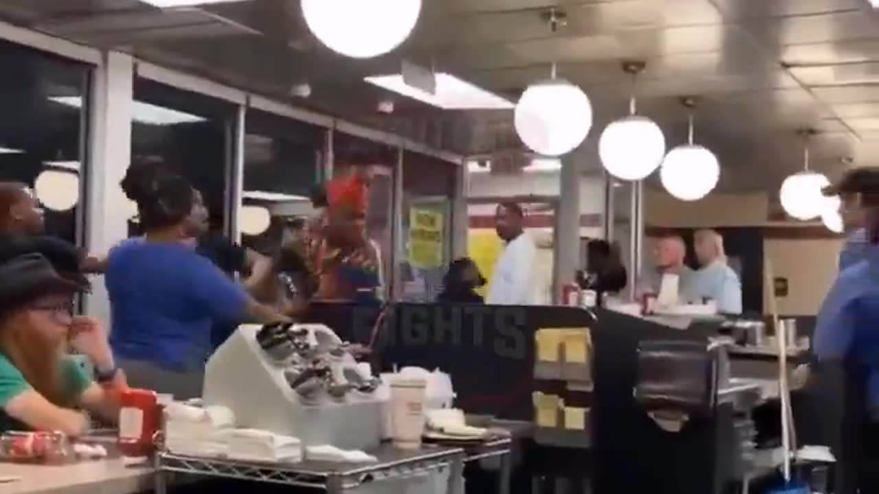 out of control dyed haired individual attacks white Waffle House staffers.