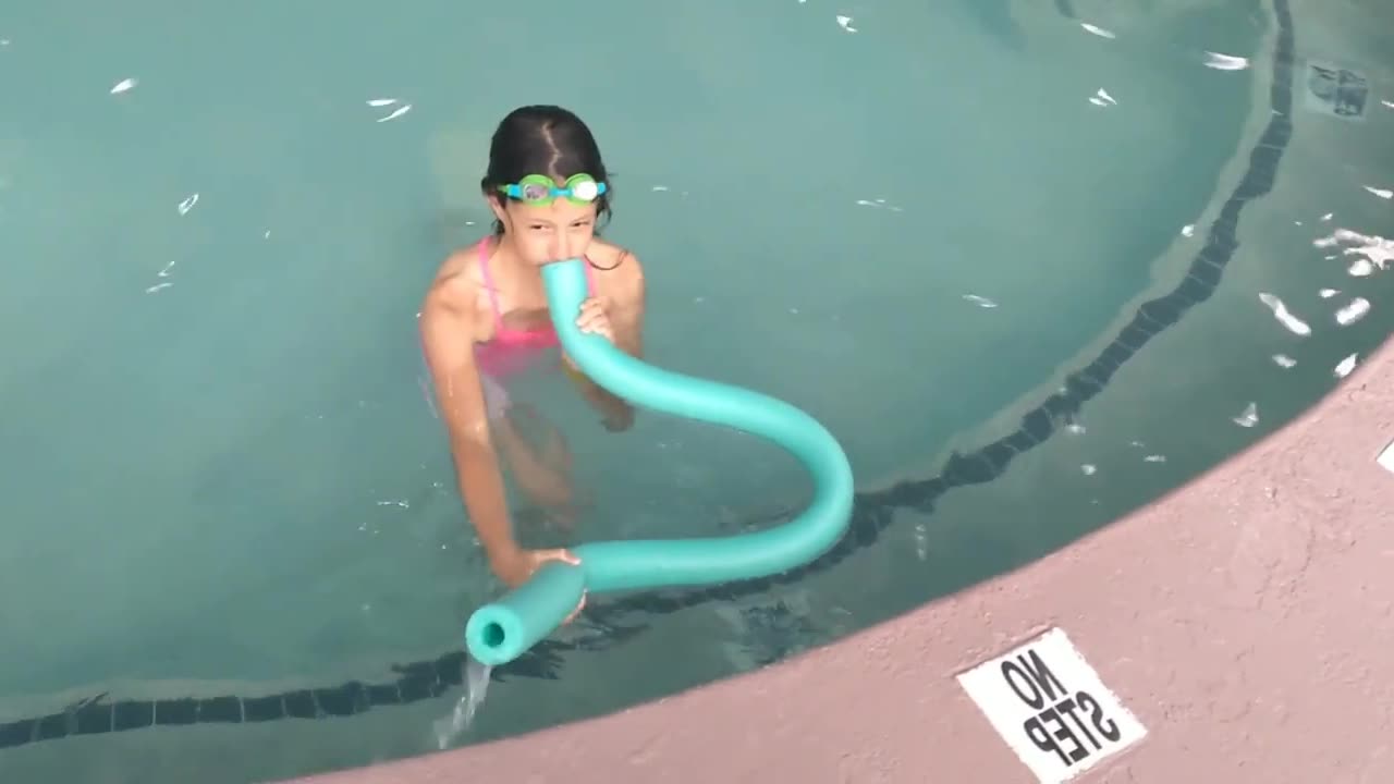 Siphoning water at the pool without drinking it.