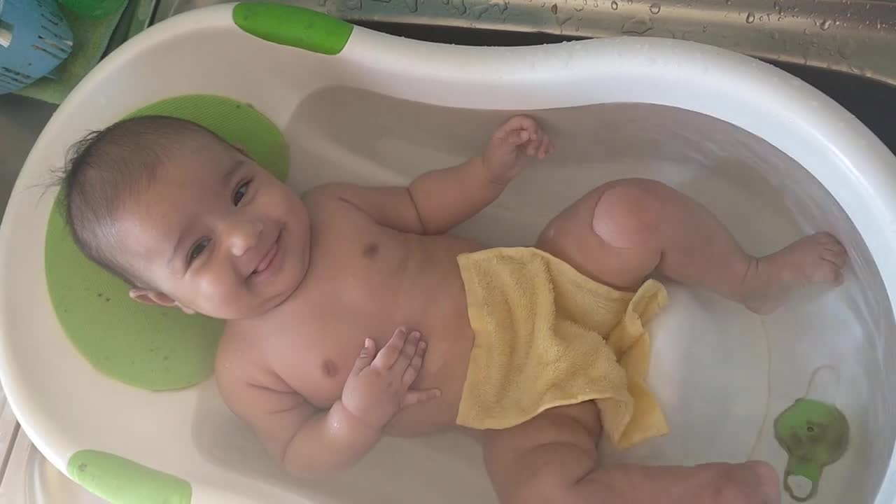 baby taking a bath alone