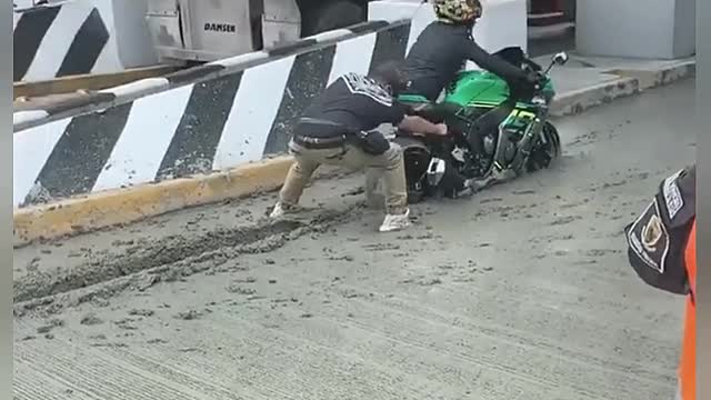 Motorcycle Gets Stuck in Wet Concrete