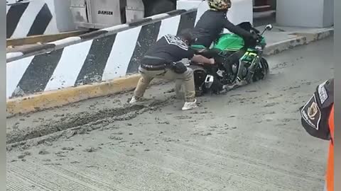 Motorcycle Gets Stuck in Wet Concrete